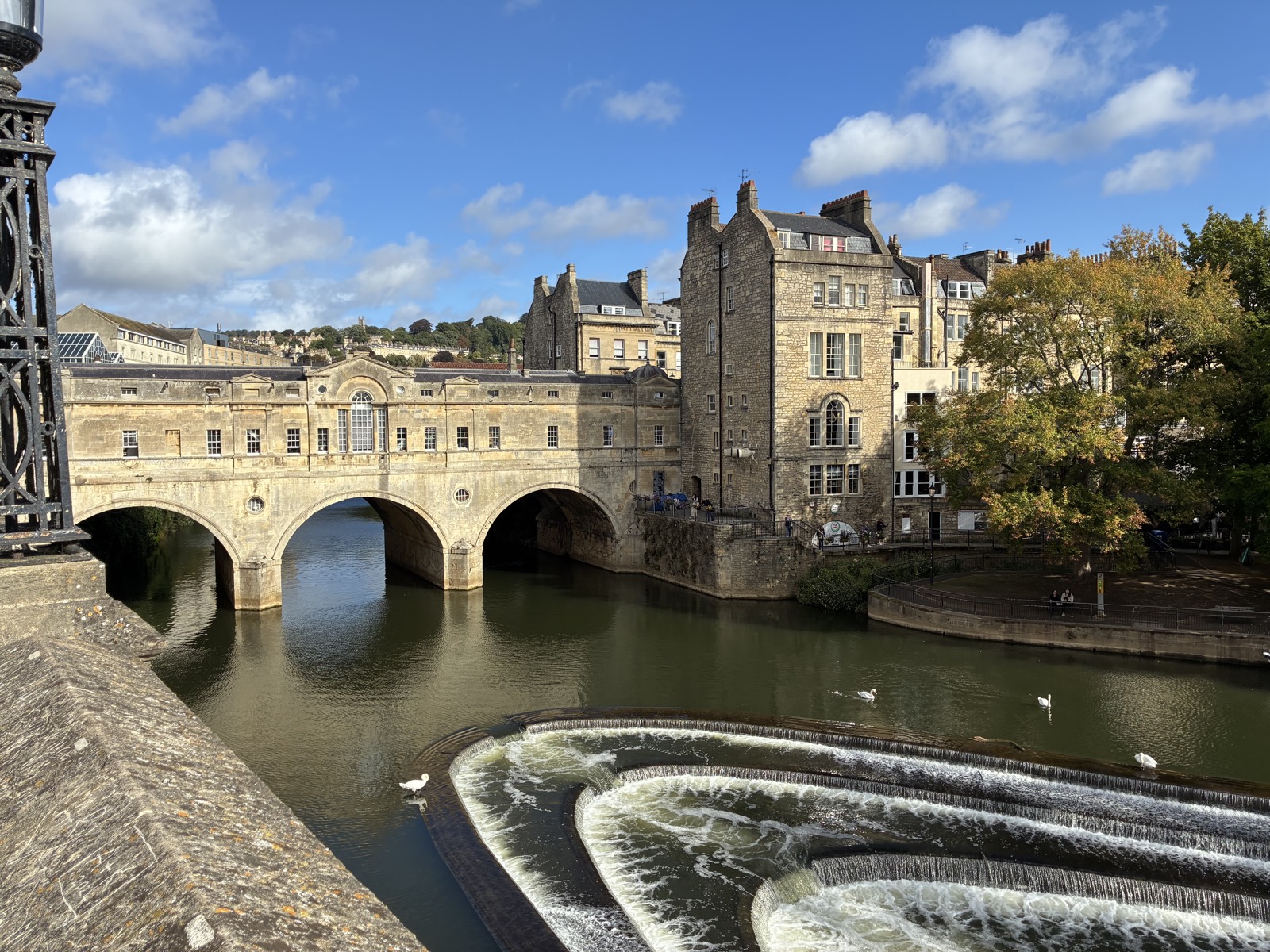 Pulteney Bridge and the curved weir on the River Avon in Bath, England.