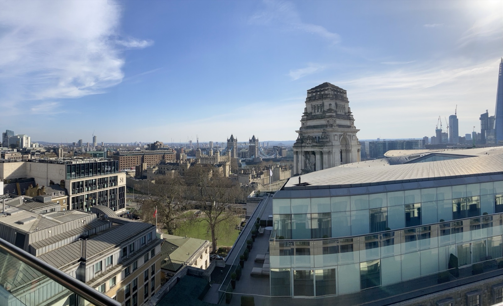 A rooftop view across London toward Tower Bridge and the Shard.